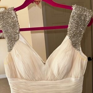 Elegant Cream Sleeveless Dress with Silver Accents